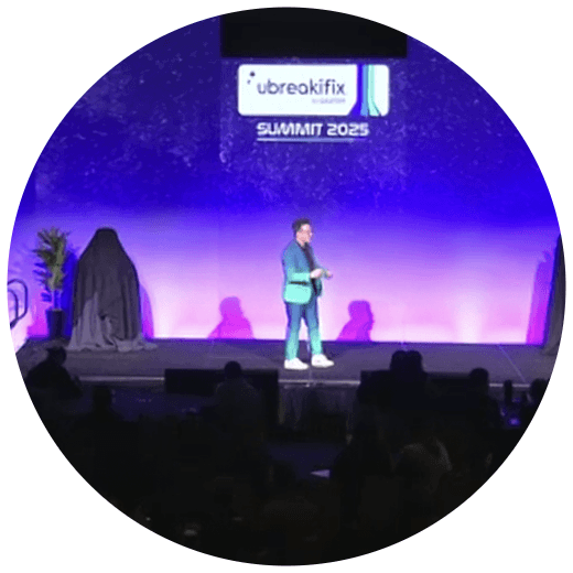 Paul Garber on stage giving the uBot launch keynote at the uBreakiFix Summit